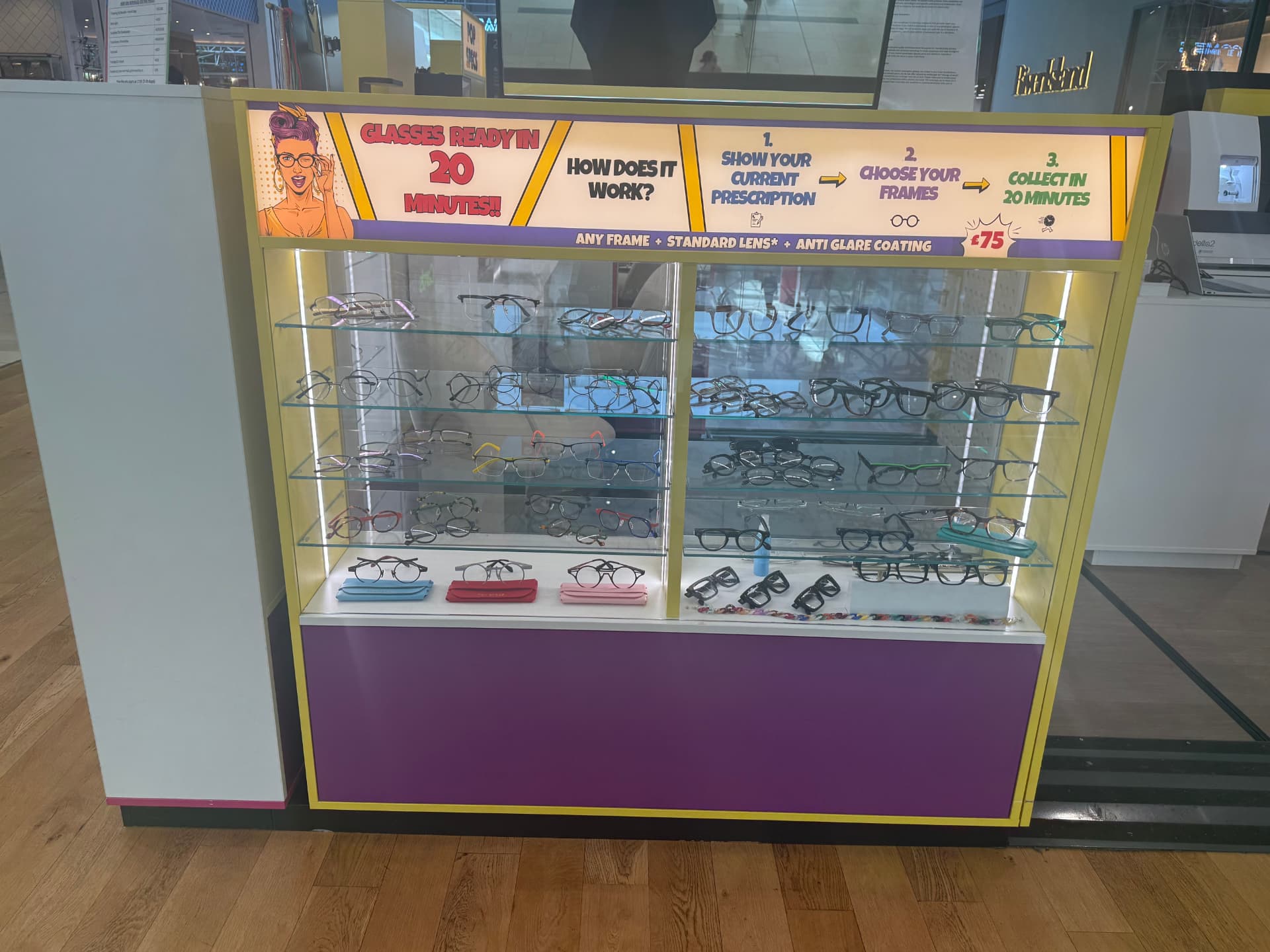 Glass display cabinet of colourful prescription glasses frames at the Pop Specs Derby kiosk